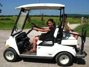 kids on a golf cart