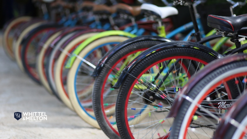 Row of colorful bicycles lined up, representing the need for legal help after a bike accident.